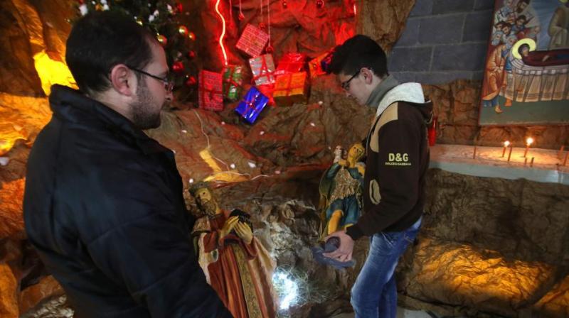 Clashes heavily damaged part of the Church of the Holy Belt and left another section burned, and the road leading to it remains punctured by a huge crater. (Photo: AFP)