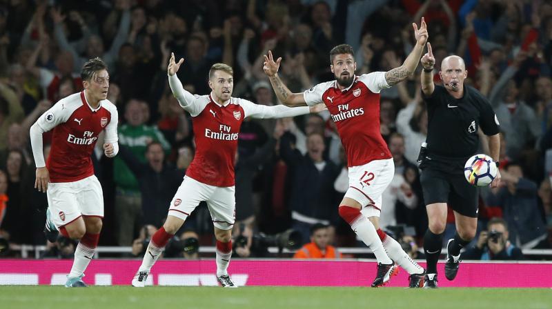 English Premier League: Oliver Giroud goal helps Arsenal to 4-3 win vs Leicester