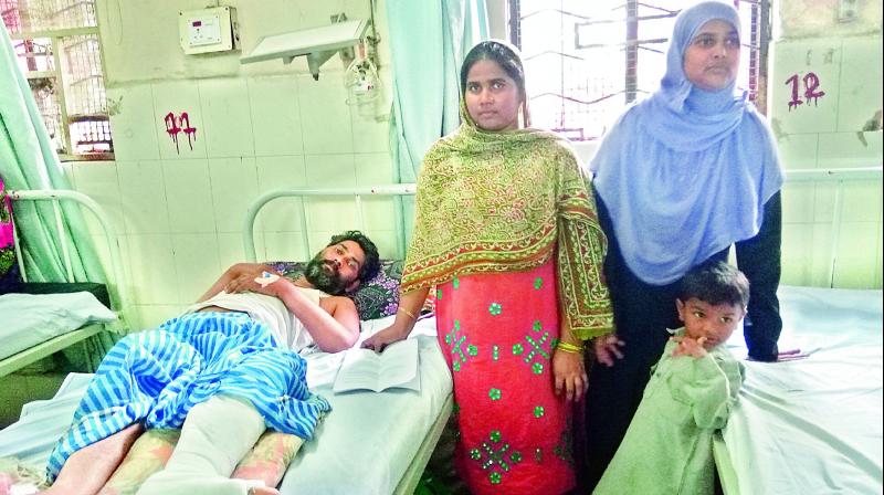Md. Nayeem, who was brutally attacked by money lenders a few days ago, at the OGH on Thursday. (Photo: DC)