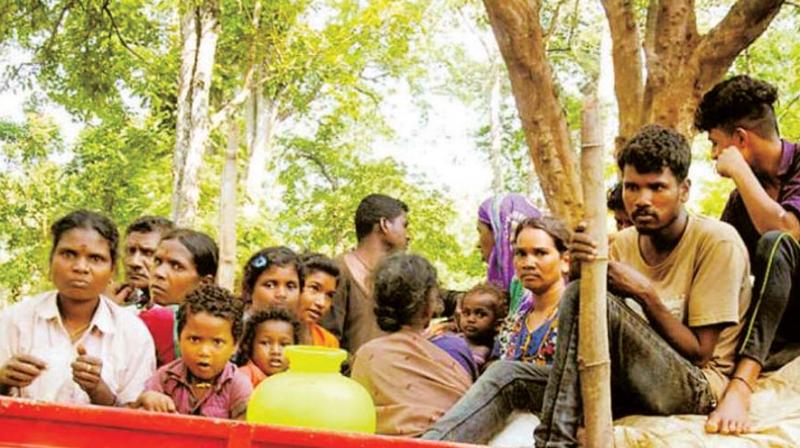 A file photo of tribals from Diddalli being taken to the new colony at Bedagudda in Somwarpet taluk of Kodagu.