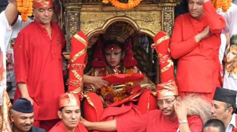 nce she is anointed a living goddess, the Kumari is only allowed to leave her new home 13 times a year on special feast days, when she is paraded through Kathmandu in ceremonial dress and elaborate makeup to be worshipped. (Photo: AFP)