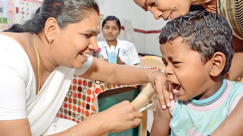 A child gets Measles Rubella vaccination at Ashok Nagar on Monday.