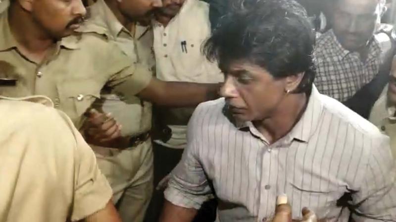 Kannada actor Duniya Vijay being taken to custody in Bengaluru on Sunday 	Image: DC