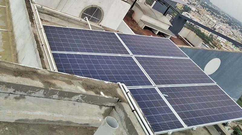 Solar panels installed on the terrace of a 13-floor apartment on 200 feet radial road aka Pallavaram-Thoraipakkam road in Pallikaranai.