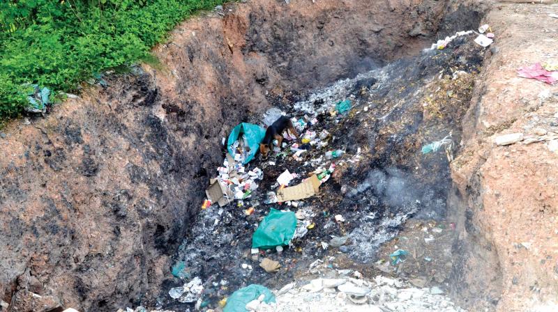 The waste burning pit behind the CDC building in medical college campus.   Peethambaran Payyeri