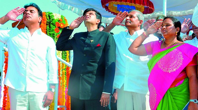 Minister K.T. Rama Rao salutes the Tricolour on Friday. (Photo: DC)