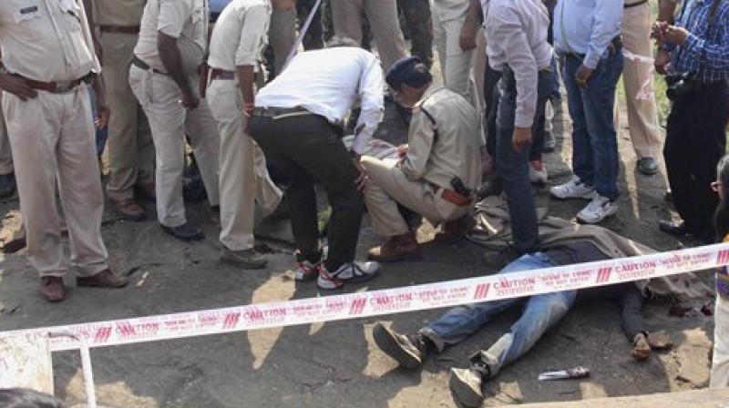 Police inspect the site of the encounter. (Photo: PTI)