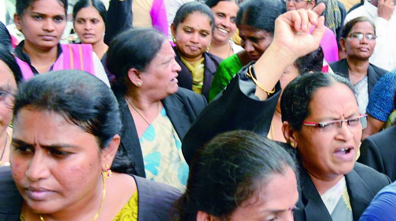 Members of Vijayawada Bar Association protest against the attack on a woman advocate in the city on Wednesday.
