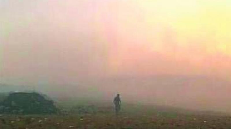 Smoke rising from the ground at MK Palli village in the outskirts of Anantapur on Wednesday. (Photo: DC)