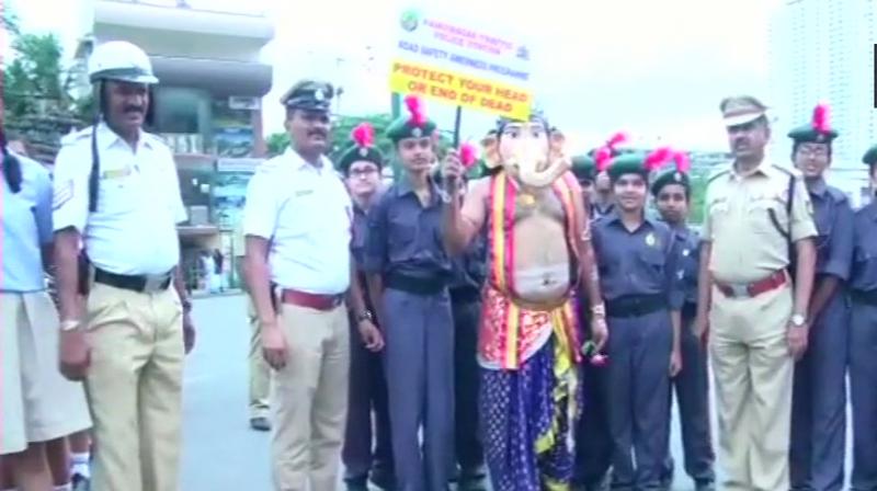 A man dressed as Lord Ganesha participated in the road safety drive in Bengaluru on Monday. (Photo: ANI)