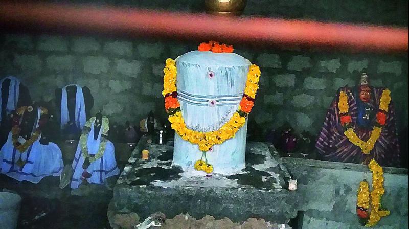 Sivalinga and other deities placed in a shed on top of the hill at Chikkavaram in Krishna district on Saturday.