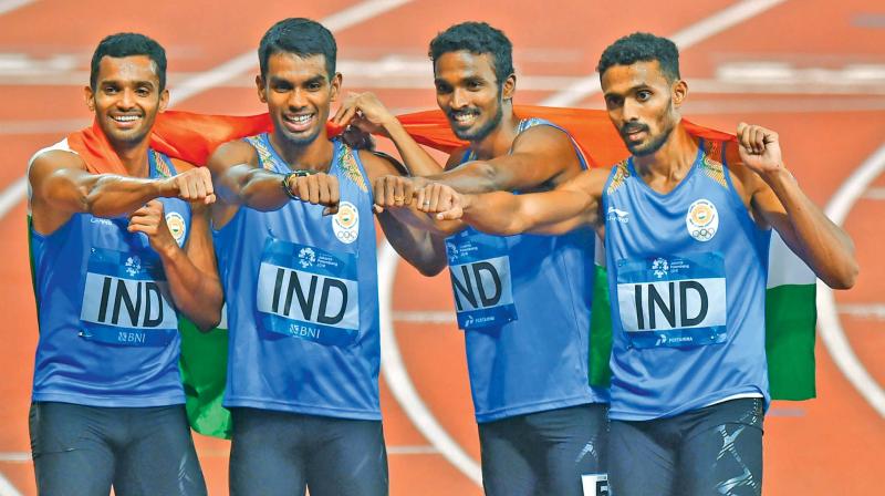 S. Arokia Rajiv (third from left) celebrates his medal with his team-mates. (Photo:AP)