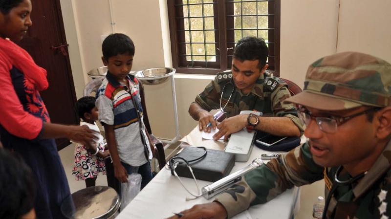 Doctors of Army Medical Corps offer consultation at the PHC they set up at Manjummal in Kochi on Friday. (Photo:DC)