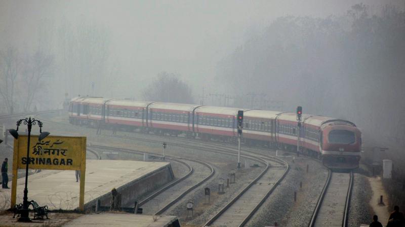 A train moves on the Srinagar -Budgam railway track. (Photo: PTI)