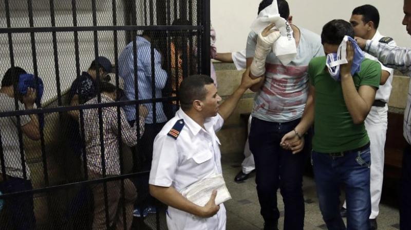 Eight Egyptian men convicted for inciting debauchery following their appearance in a video of an alleged same-sex wedding party on a Nile boat leave the defendants cage in a courtroom in Cairo, Egypt, November 2014. (AP FIle Image)
