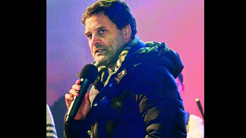Congress president Rahul Gandhi in a Burberry coat addresses a musical evening in Shillong late on Tuesday. (Photo: PTI)