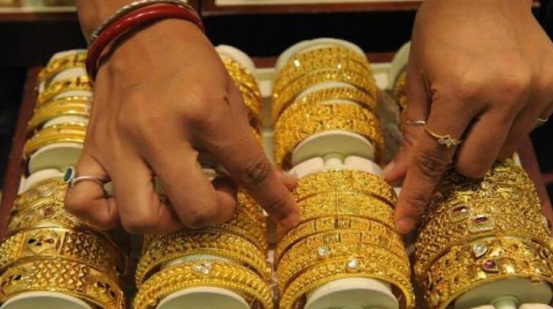 Analysts attributed the fall in gold futures to profit-booking by participants at existing levels and a weak trend overseas.