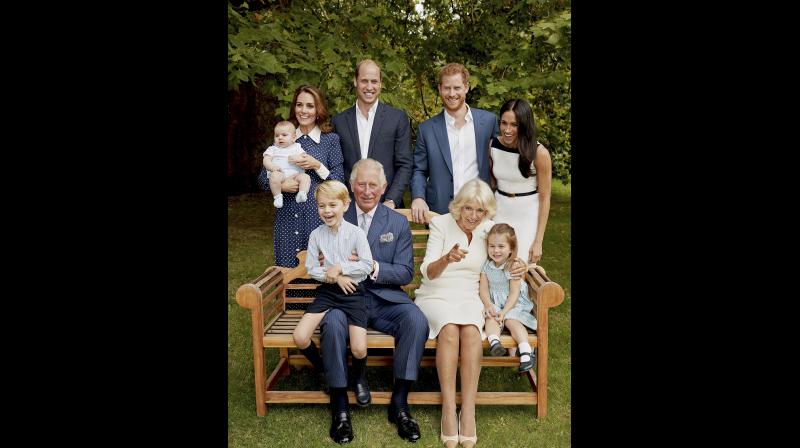 In this handout image provided by Clarence House and taken on Sept. 5, 2018, Britains Prince Charles poses for an official portrait to mark his 70th Birthday in the gardens of Clarence House, with Camilla, Duchess of Cornwall, Prince William, Kate, Duchess of Cambridge, Prince George, Princess Charlotte, Prince Louis, Prince Harry and Meghan, Duchess of Sussex, in London, England. (Photo: Twitter/Kensington Palace)