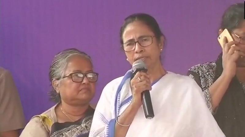 West Bengal chief minister Mamata Banerjee sits on her Save the Constitution dharna at Metro Channel, Kolkata. (Photo: ANI | Twitter)