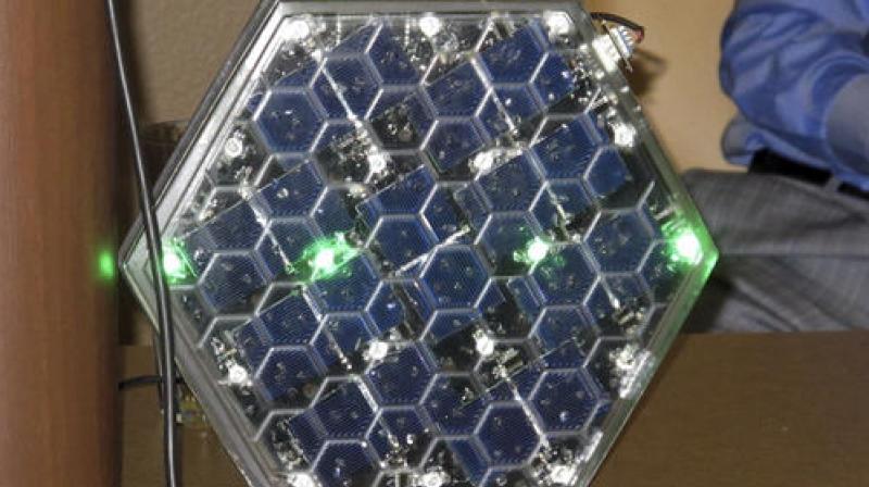 Solar Roadways has been testing the strength of its half-inch-thick glass by dropping 1-pound steel balls on it from a height of 8 feet. (Photo: AP)