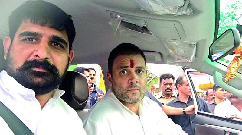 riding the city in style: Kaushik Reddy along with Rahul Gandhi.