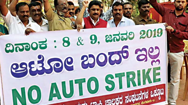 Members of the Bengaluru Auto Drivers Union and Welfare Associations Federation demonstrate against transport strike called by several trade bodies, in Bengaluru on Monday (Image DC)