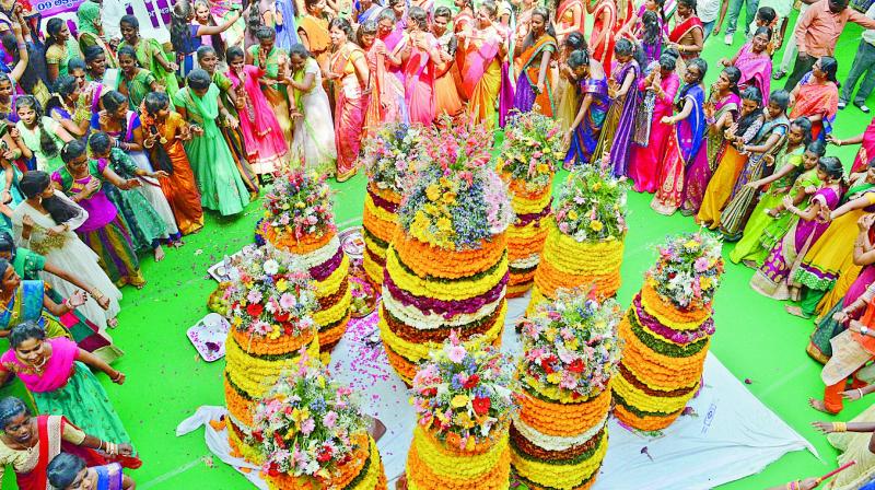 Women from various parts of the city gathered at Nampally to celebrate the first day of the nine-day Bathukamma festivities.