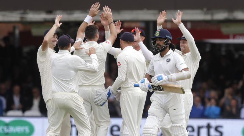 England players celebrate the dismissal of Murali Vijay, after the Indian was dismissed in the first over. (Photo: AP)