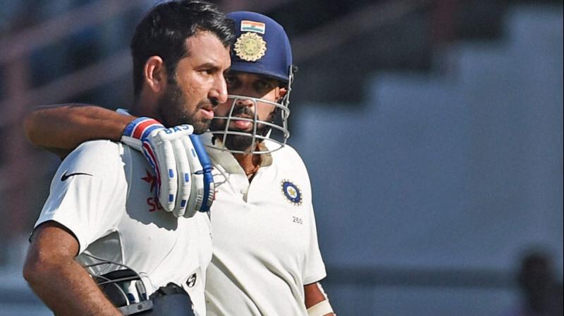 Hundreds from Cheteshwar Pujara and Murali Vijay have made sure that India stay in hunt in the first Test against England in Rajkot. (Photo: PTI)