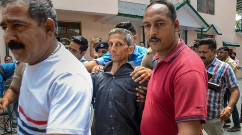 Police produce Vijay Singh, who allegedly shot dead Assistant Town and Country Planning officer Shail Bala Sharma during an anti-demolition drive on May 1, in a court in Kasauli on Friday. (Photo: PTI)