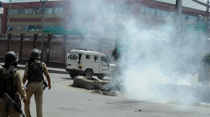 Police resorted to teargas shelling in SMHS Hospital Srinagar in Kashmir to disperse the crowd who were resisting seizure of a dead body of a civilian. The civilian was crushed to death by security forces vehicle during protests near gunfight sight in capital Srinagar, of Kashmir. The gunfight broke out between militants and security forces in Gasi Mohalla area of Srinagar. (Photo: H U Naqash)