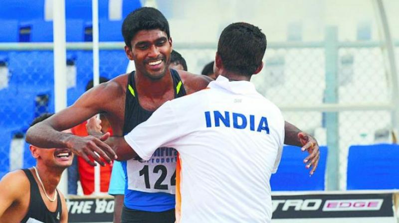 Half-miler Jinson Jhonson (left) celebrates with coach Mohammed Kunhi after securing his Rio berth on Monday. (Photo: DC)