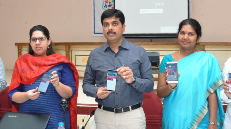 File photo of Guntur collector K. Sasidhar, Guntur joint collector Kritika Sukla and Guntur Municipal commissioner Ch. Anurada launching Pura Seva app.