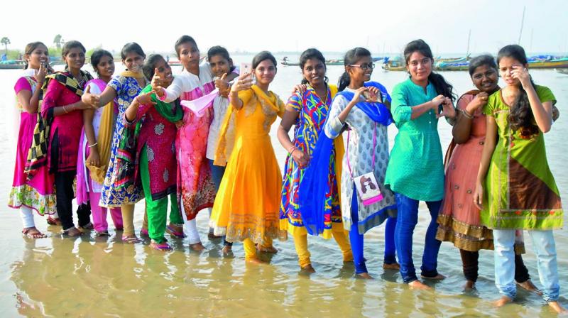 Girls at the Flamingo Festival take a selfie at Pulicat lake near Sullurpeta in Nellore district. (Photo: DC)