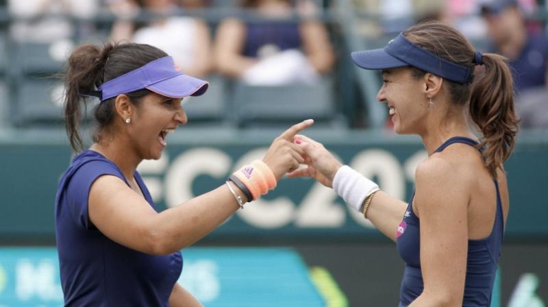 Sania had split with womens doubles partner Hingis but they paired up and made an unsuccessful bid to defend the WTA Finals Singapore. (Photo: PTI)