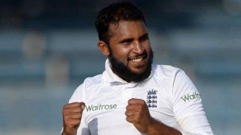 Adil Rashid on Sunday became just the 14th player and first Englishman in 13 years to complete a Test without bowling, batting, taking a catch or effecting a run out as England beat India to win the Lords Test and take 2-0 lead in the five-match Test series. (Photo: AFP)