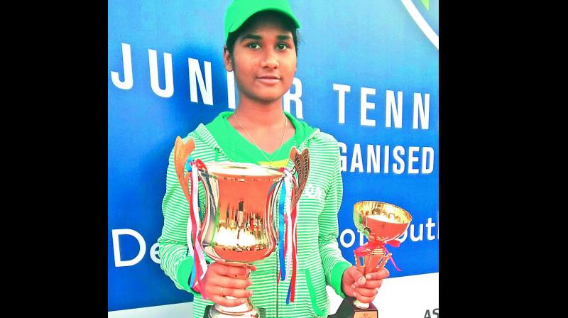 Telangana girl Sunskrithi Damera poses with her trophies from the All-India Tennis Super Series Championship played recently in Kolkata. Sunskrithi won the girls U-14 singles and finished runner-up in the U-16 singles and U-16 doubles categories.