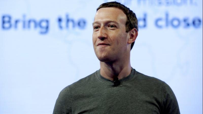 Facebook CEO Mark Zuckerberg speaks during preparation for the Facebook Communities Summit, in Chicago. Zuckerberg embarked on a rare media mini-blitz, in the wake of a privacy scandal involving a Trump-connected data-mining firm. (AP Photo/Nam Y. Huh, File)