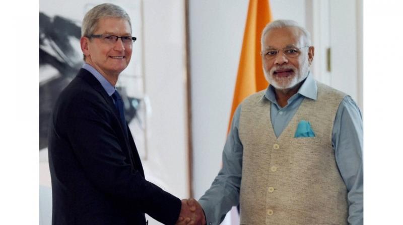 Apple CEO Tim Cook with PM Narendra Modi.