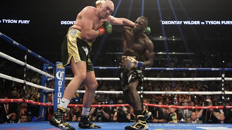 After exchanging harsh words in the leadup to the fight, both men were full of praise for each other following the final bell and were eager for a rematch. (Photo: AP)