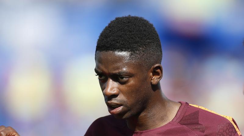 Ousmane Dembele was injured Saturday during Barcelonas 2-1 win at Getafe in the Spanish league.(Photo: AP)