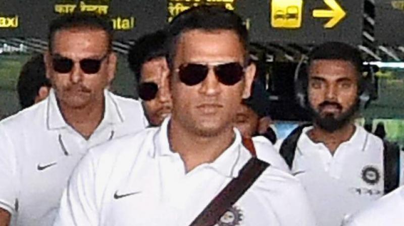Dressed it white T-shirts, the men-in-blue looked relaxed as they headed straight to the team hotel along with their support staff and chief coach Ravi Shastri.(Photo: PTI)