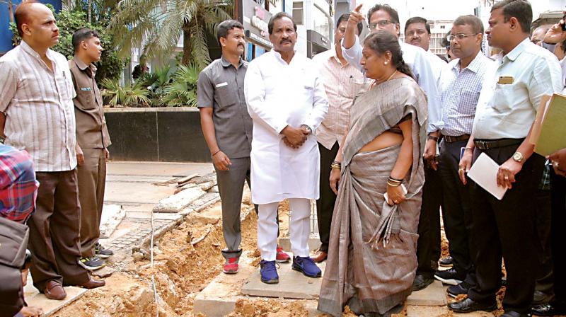 Bengaluru Development Minister K.J. George along with City Mayor G. Padmavathi inspecting the ongoing work at Church Street in Bengaluru on Thursday.