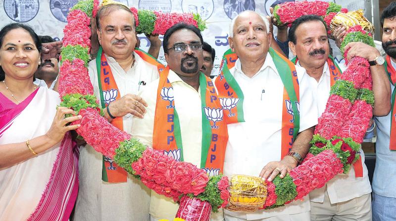 Vishwakarma community leader K P Nanjundi joined BJP in presence of party state president B S Yeddyurappa, Union Ministers Ananth Kumar and D.V. Sadananda Gowda at the party office in Bengaluru on Monday. (Photo: DC)