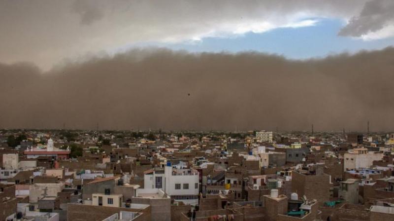 The dust storm caused major destruction in Alwar where more than 100 trees were uprooted, many of which fell on stationary vehicles and snapped electricity cables. (Photo: PTI)