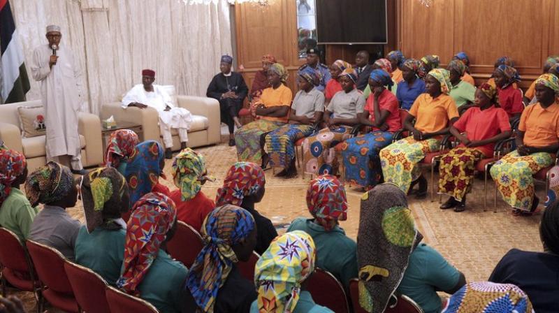 Nigerias President, Muhammadu Buhari, left, meets with Chibok school girls recently freed from Nigeria Extremist captivity in Abuja (Photo: AP)