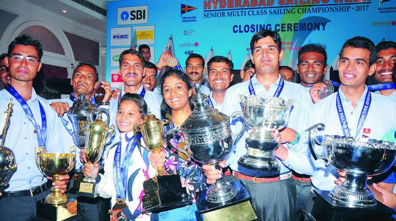 Winners at the Hyderabad Sailing Week are all smiles as they pose with their trophies at the prize distribution ceremony at Hussainsagar lake in Hyderabad on Saturday.(Photo: Deepak Deshpande)