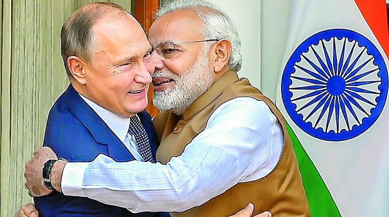 Prime Minister Narendra Modi hugs Russian President Vladimir Putin before their meeting at Hyderabad House, in New Delhi, on Friday.  (Photo:PTI)