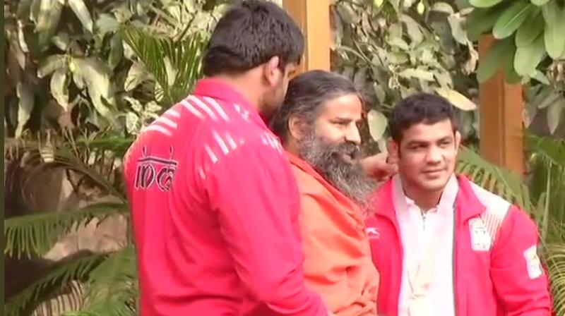 Ramdev heaped praise on two-time Olympic medallist Sushil Kumar after he bagged a gold medal in 2018 Gold Coast Commonwealth Games. (Photo: ANI)