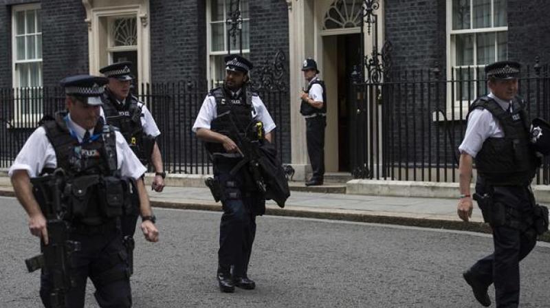 Armed British police officers patrol near 10 Downing Street, the official residence of British Prime Minister. (Photo: Representational Image/AFP)